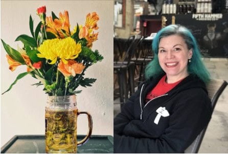 Bright floral bouquet in a mason jar with yellow, orange, and green blooms.