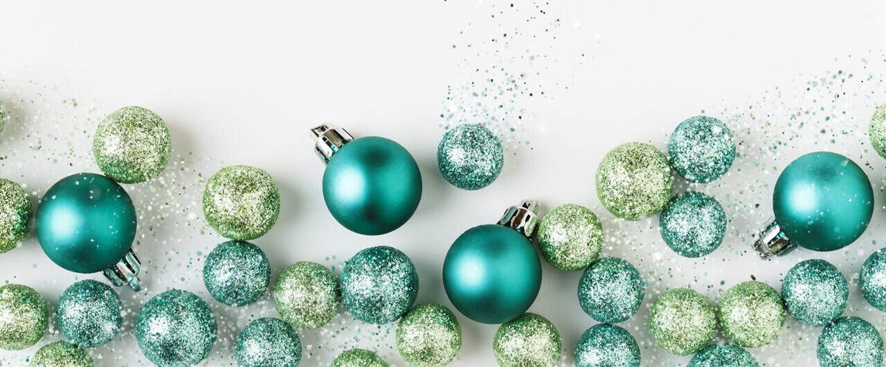 Festive mint green and teal Christmas ornaments for holiday decor.